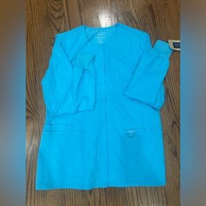 Cherokee Workwear Revolution Scrubs Jacket. Baby blue Size Medium